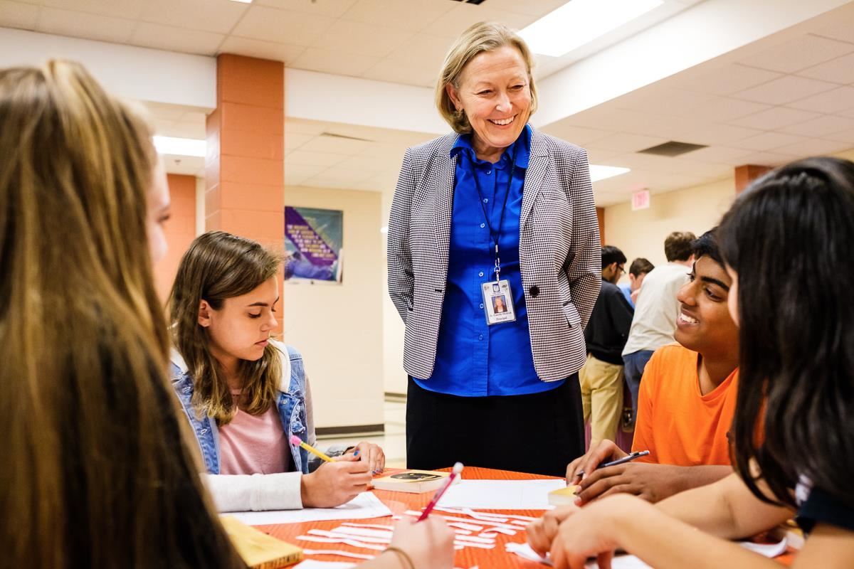 Camille Hedrick chats with her students 
